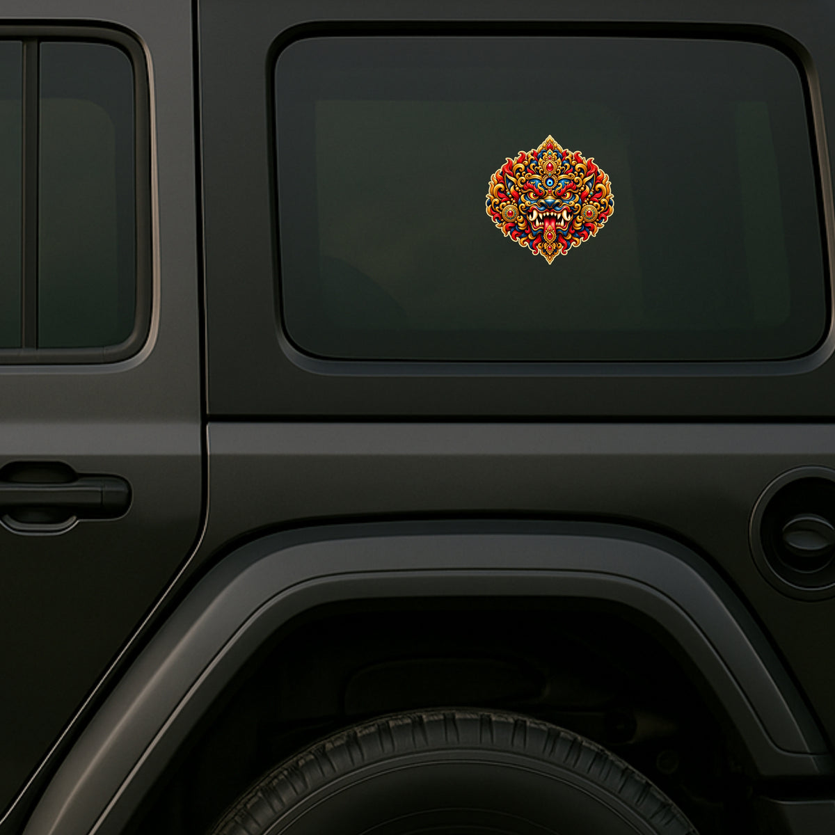 Kirtimukha Fierce Guardian Face Protective Sticker Displayed on Black SUV Rear Side Window by STIXY