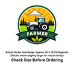 A circular sticker design featuring a stylized tractor in a farm field with trees and a cloud, under a sunburst background, with a dark green banner reading “FARMER” and a leaf motif. Below the sticker is text stating the actual sticker size range is approximately 16 x 18 cm and to check the size before ordering, on a white background.