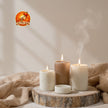 STIXY Jai Shri Ram Hanuman Gada Sticker Displayed on Beige Interior Wall Above Decorative Candles with Saffron Orange Spiritual Artwork