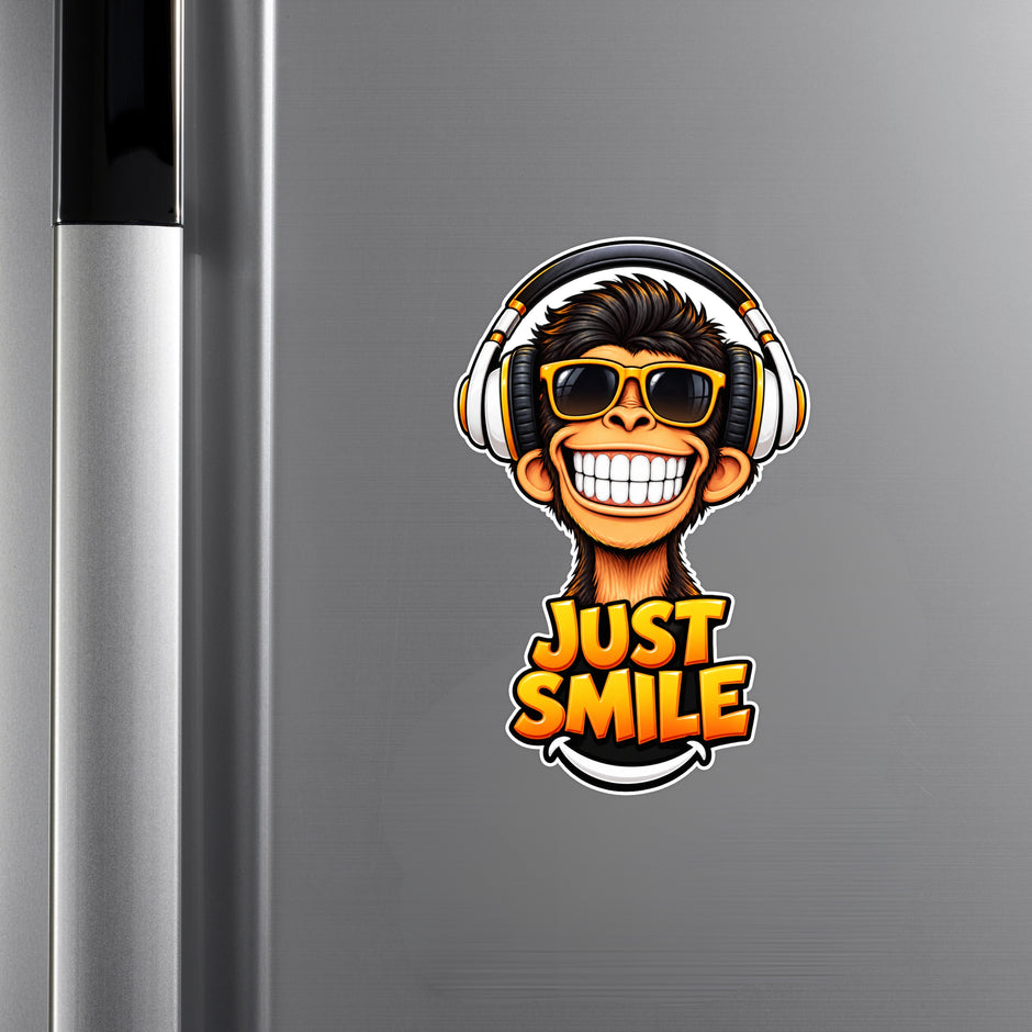 Just Smile Monkey Sticker Displayed on Black Laptop with Headphones and Sunglasses Design by STIXY