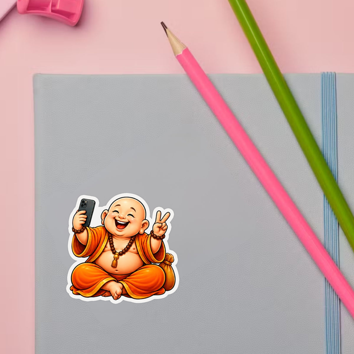 Funny Laughing Buddha Sticker Set Displayed on Study Desk by STIXY