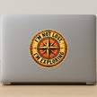 Retro Golden Compass Adventure Sticker on Laptop for Travellers and Explorers