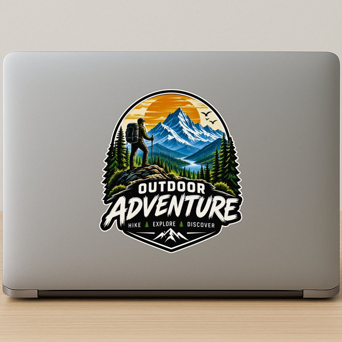 Outdoor Adventure Hike Explore Discover Sticker on Laptop Featuring Snowy Mountains Pine Trees and Hiker Silhouette