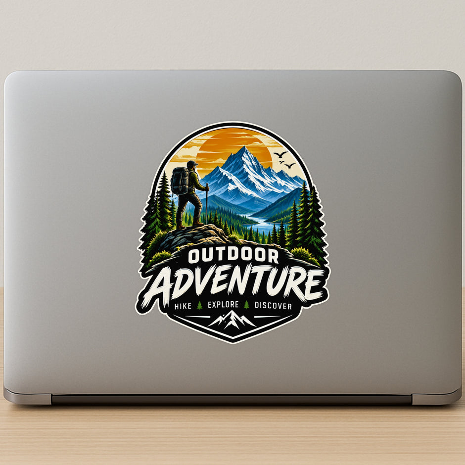 Outdoor Adventure Hike Explore Discover Sticker on Laptop Featuring Snowy Mountains Pine Trees and Hiker Silhouette